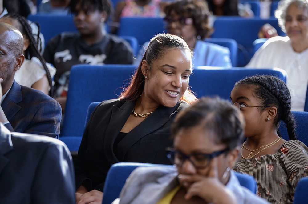 Allen women smiling together at a campus event