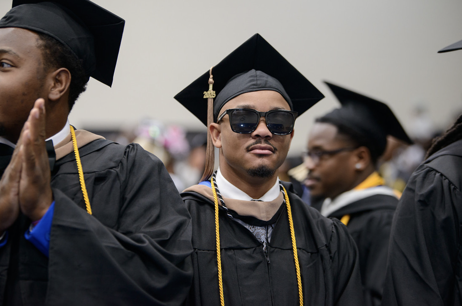 Allen graduates in caps and gowns