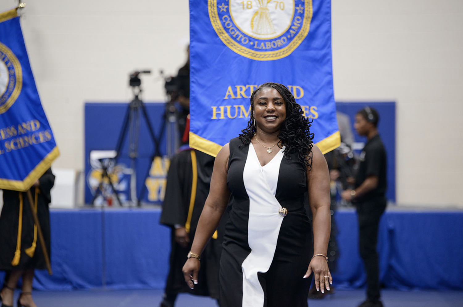 An Allen graduate smiling during a ceremony