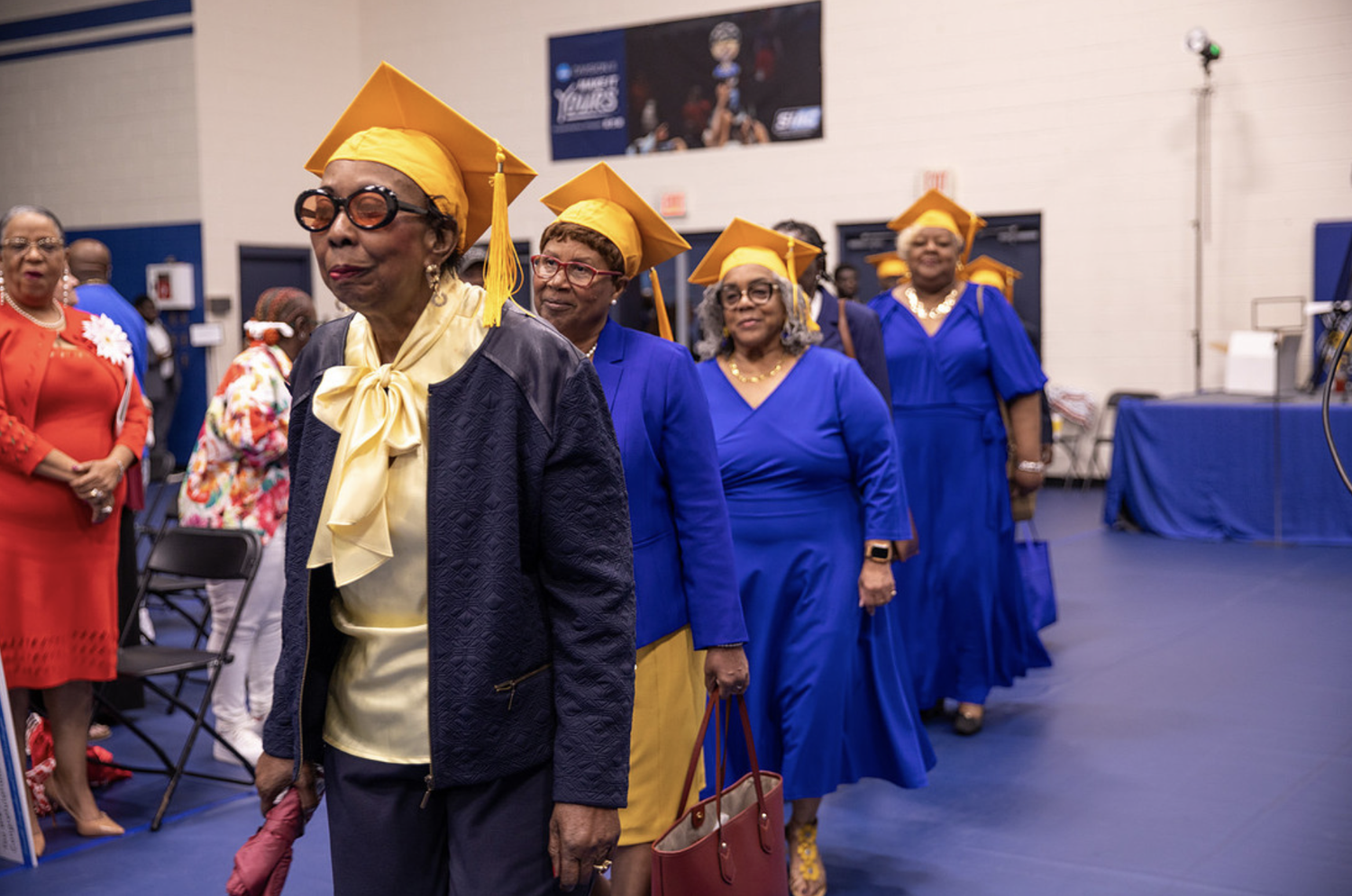 Members of the 2025 50th Golden Class processing at Commencement