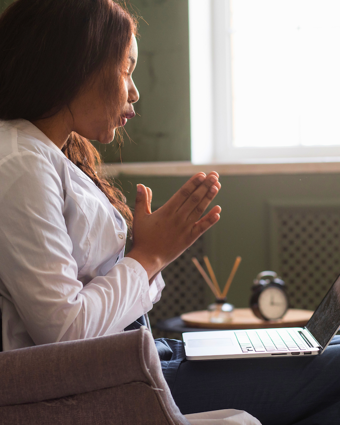 A counselor on a video call with a student