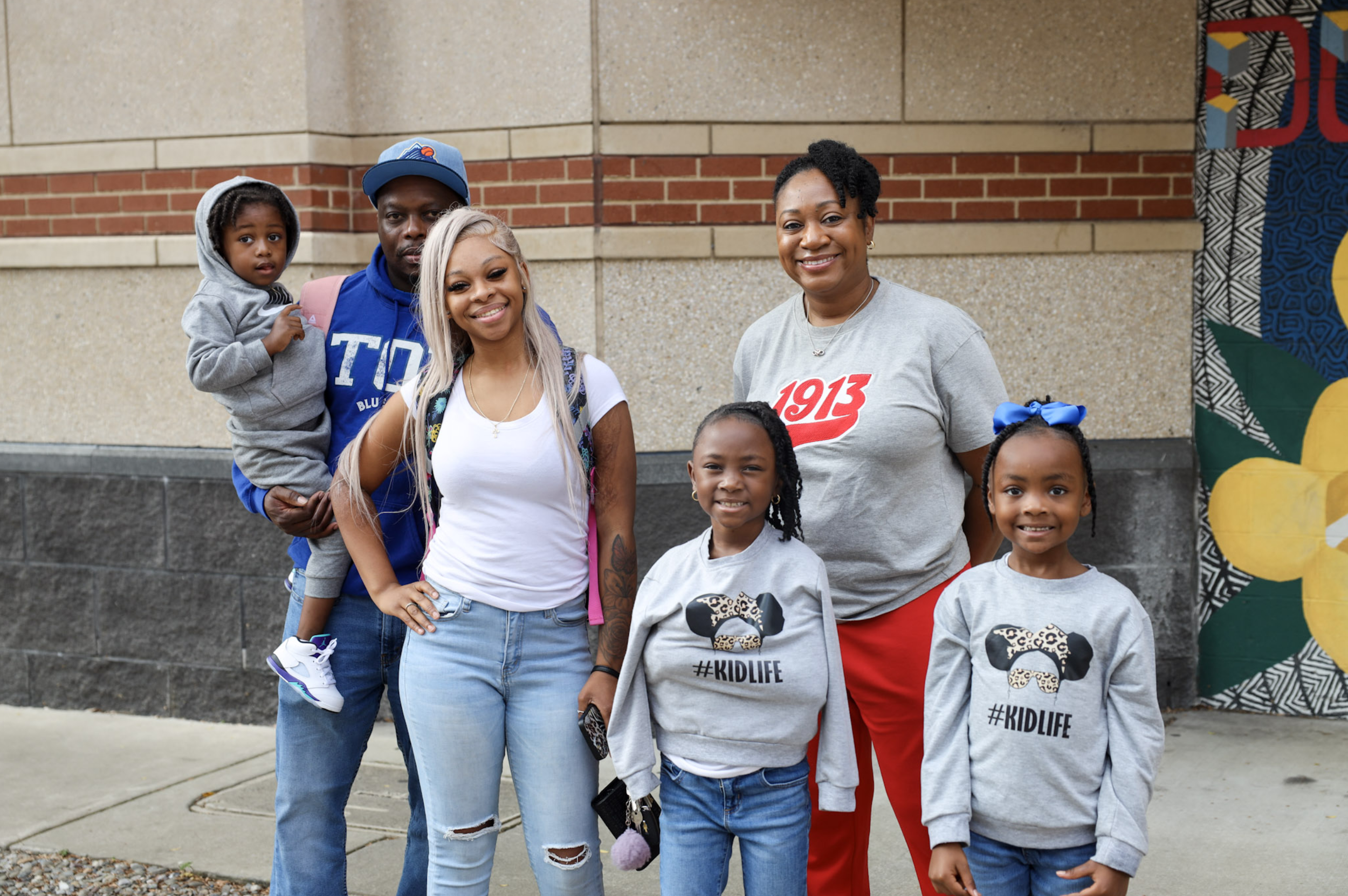 A family touring Allen University’s campus