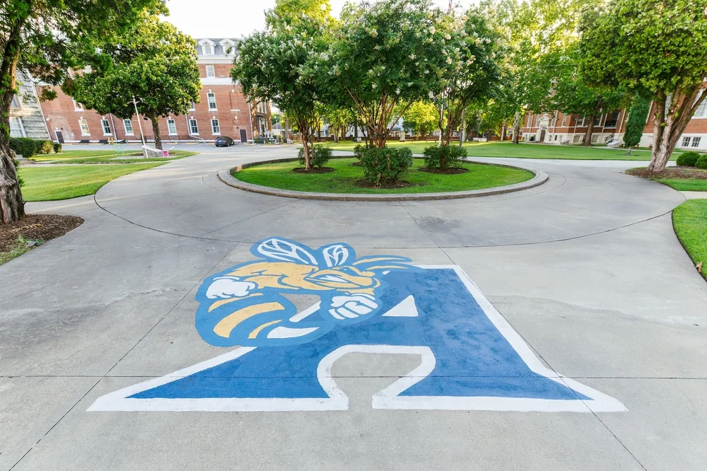 The Yellow Jacket A painted on a campus walkway