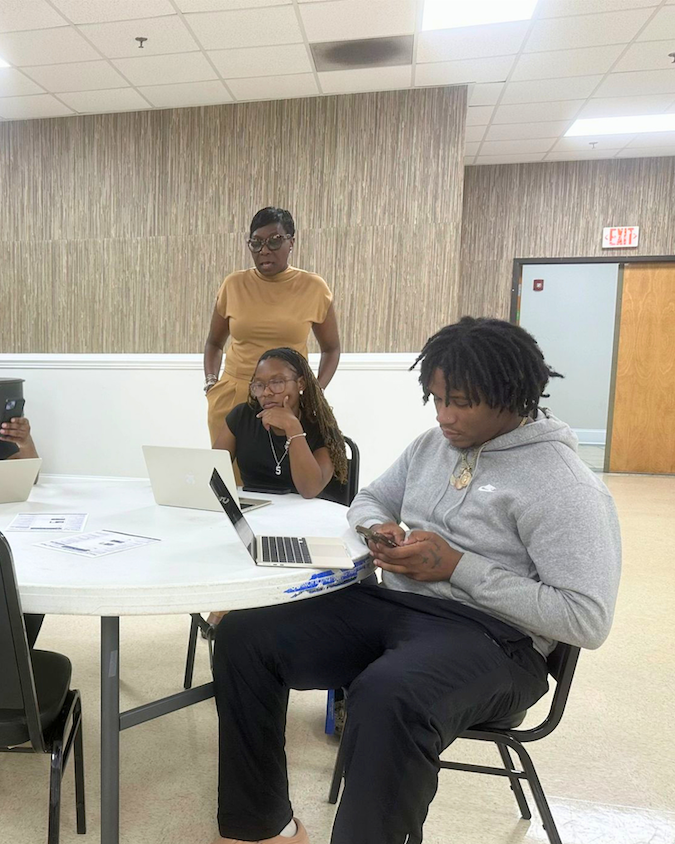 Mrs. Karla Harper working with Allen University students
