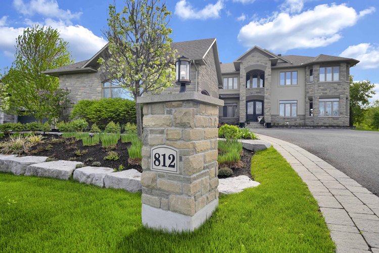 Front exterior and landscaped entrance at 812 McManus Avenue