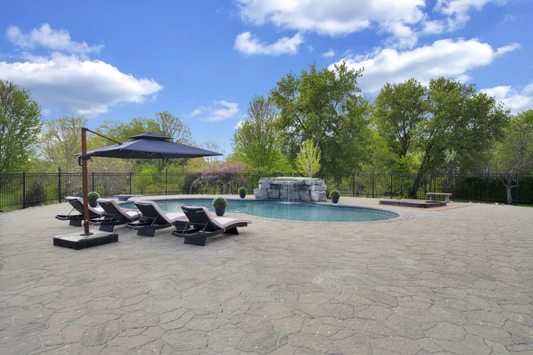 Pool and surrounding terrace at 812 McManus