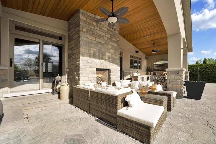 Covered terrace and outdoor fireplace at 812 McManus