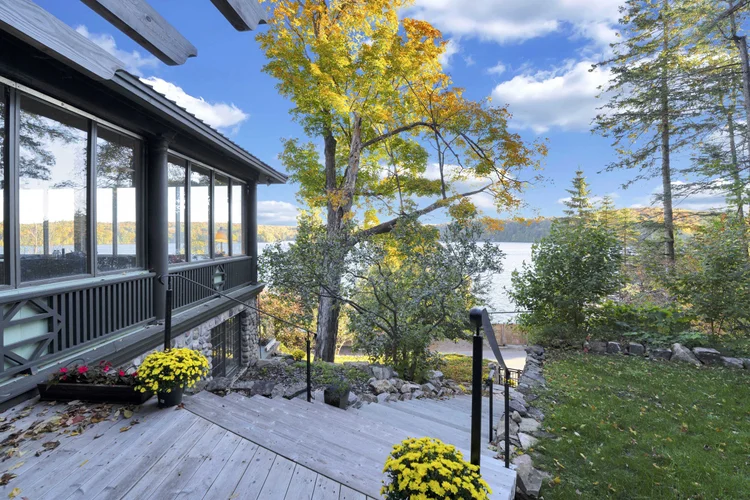 Sunroom exterior overlooking the lake at 755 Ch. du Lac-Meech, Chelsea