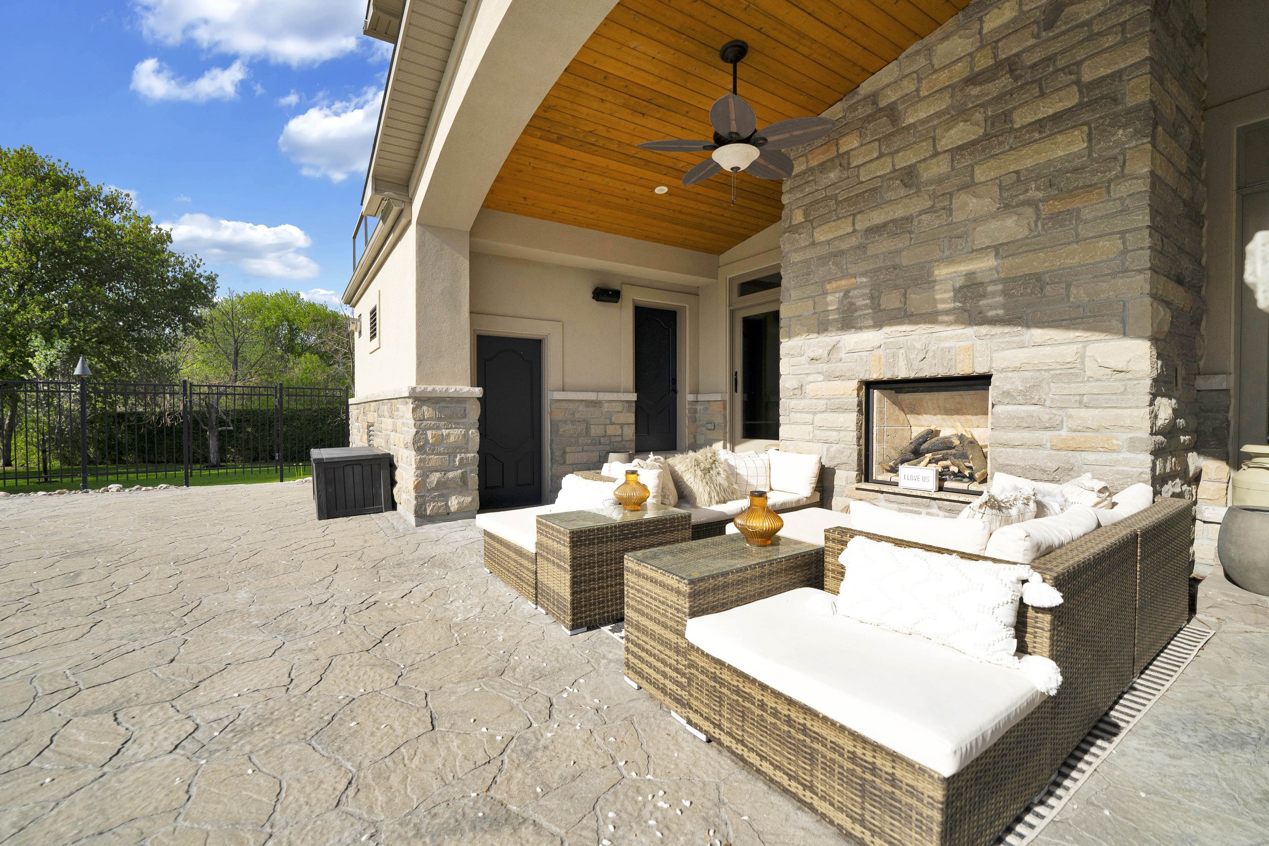 Covered terrace and outdoor fireplace at 812 McManus