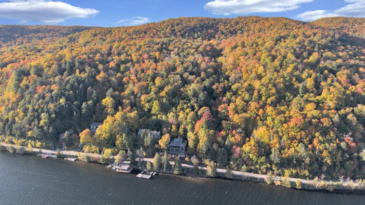 Aerial view of Meech Lake and autumn shoreline at 755 Ch. du Lac-Meech, Chelsea