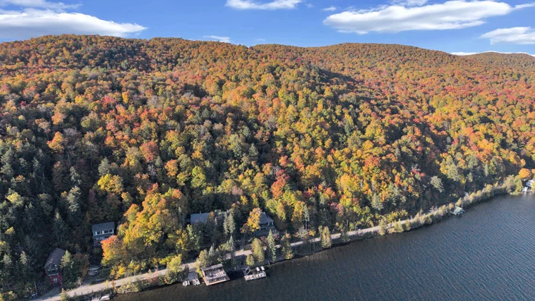Aerial view of Meech Lake and autumn shoreline at 755 Ch. du Lac-Meech, Chelsea