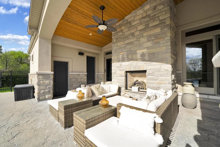 Covered terrace and outdoor fireplace at 812 McManus