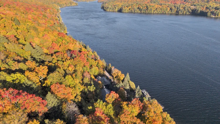 Aerial view of Meech Lake and autumn shoreline at 755 Ch. du Lac-Meech, Chelsea