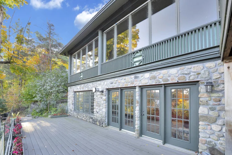 Stone and wood exterior of the home at 755 Ch. du Lac-Meech, Chelsea