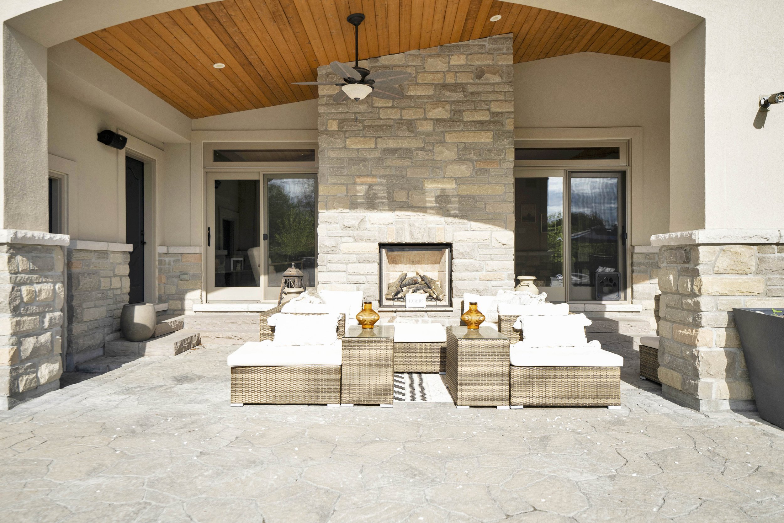 Covered terrace and outdoor fireplace at 812 McManus Avenue