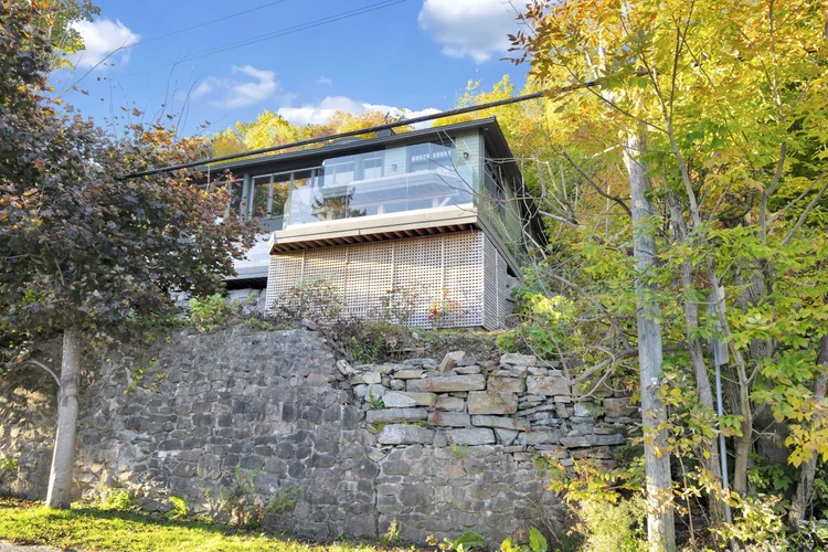 Home above the stone terrace at 755 Ch. du Lac-Meech, Chelsea