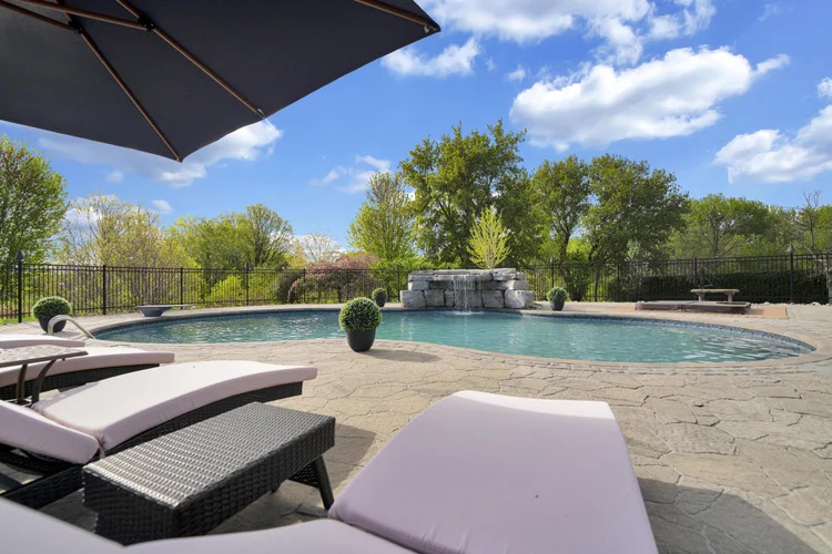 Pool and surrounding terrace at 812 McManus