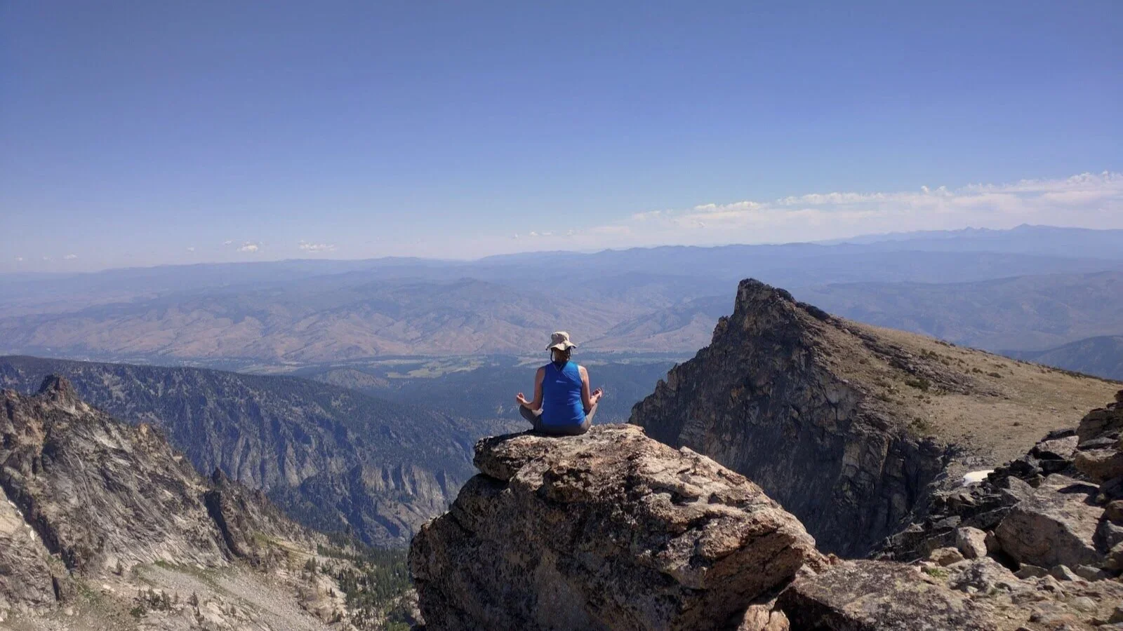 Christine meditating on a mountain in Montana's Great Burn Wilderness