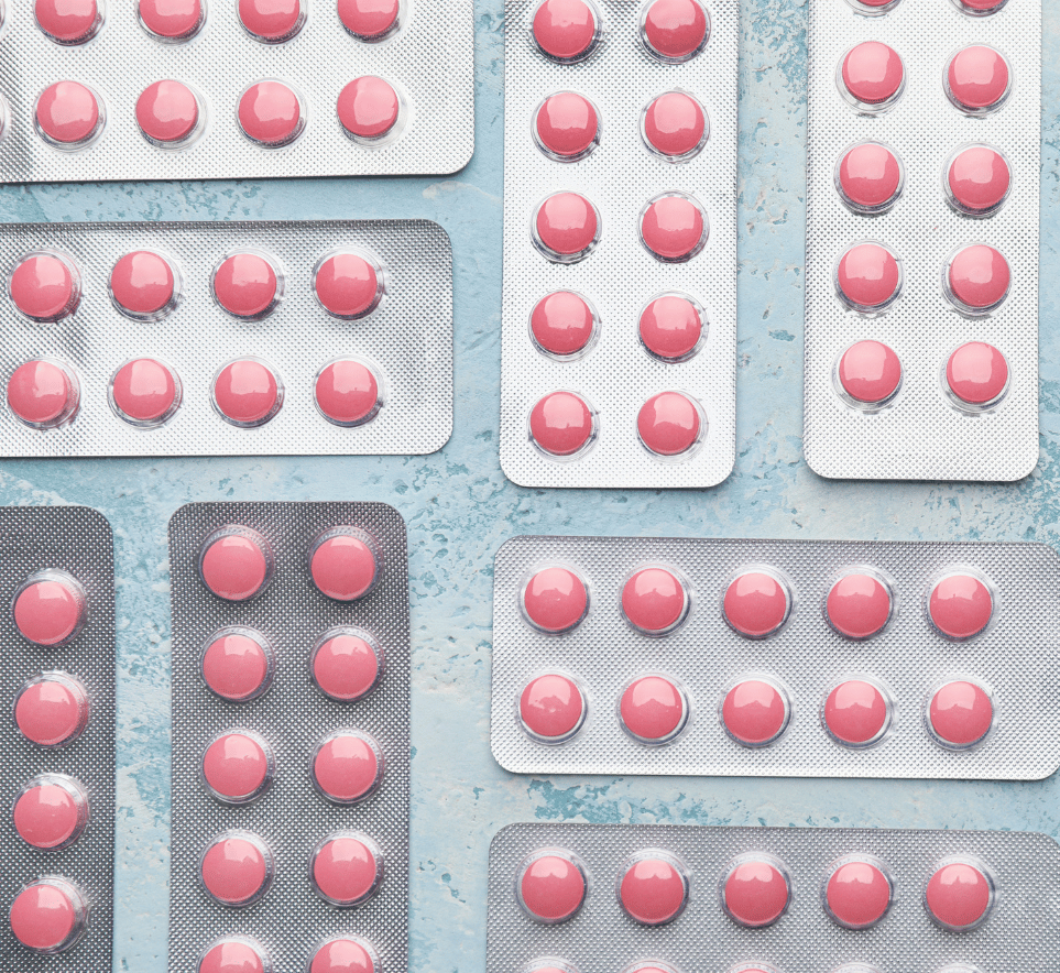 Blister packs of pink medication tablets