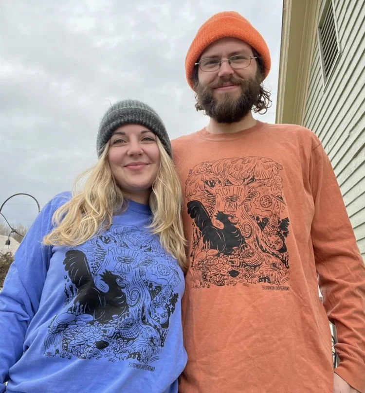 Artist Dwayne Sawtelle of Bloodmoon Underground modeling the shirt he designed.