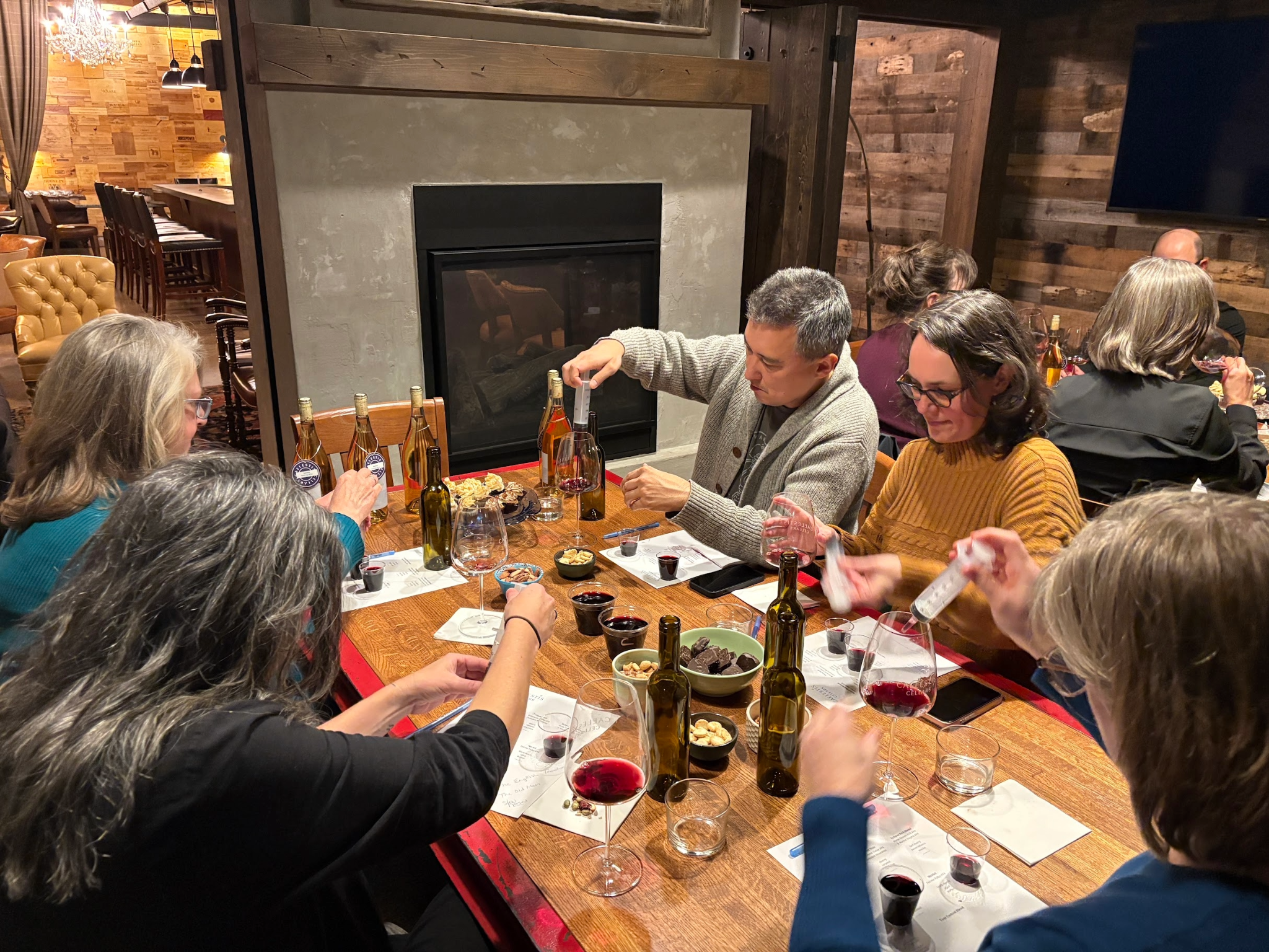 Guests taking part in a Caelestis Cellars private wine blending experience