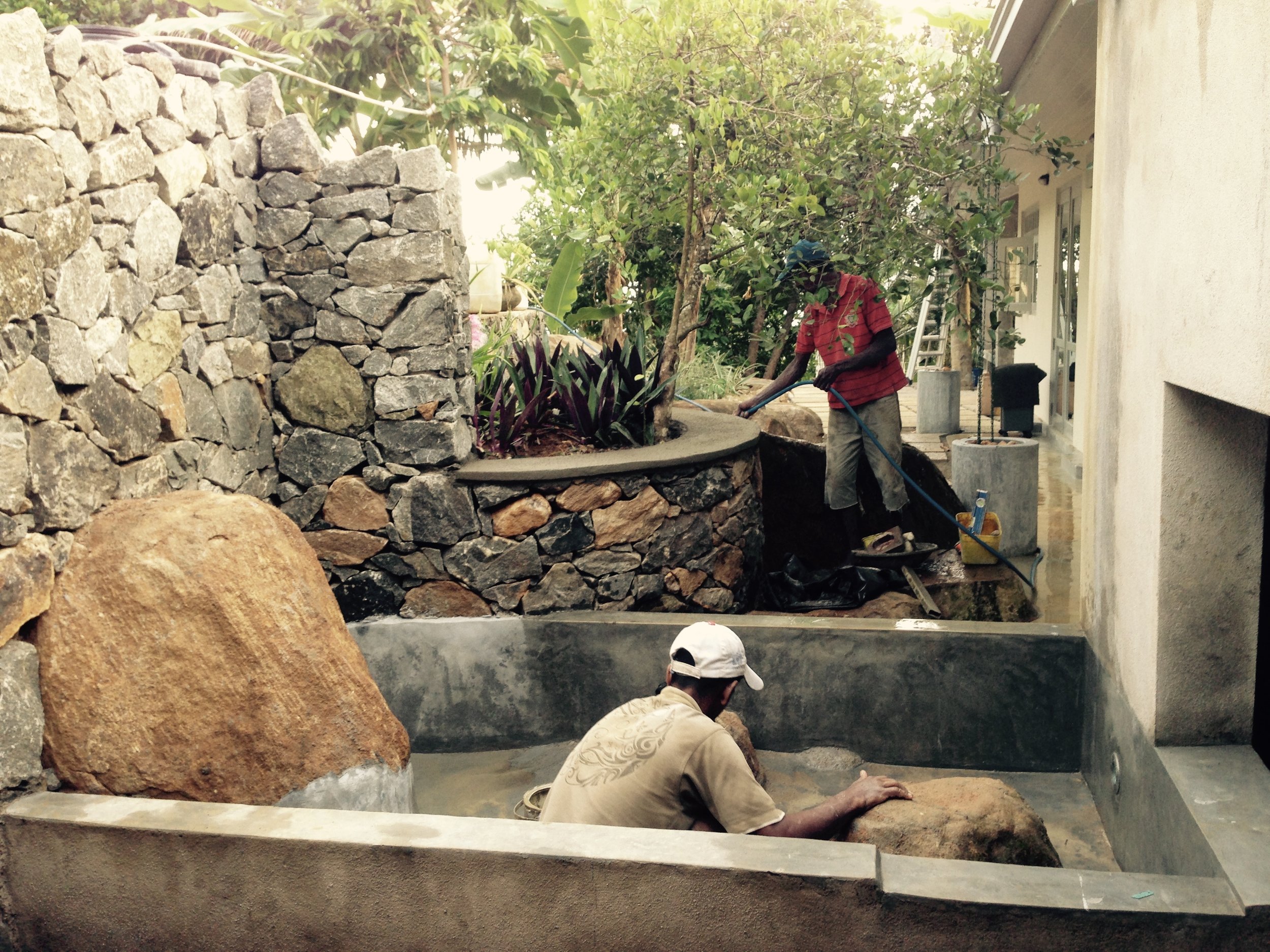 Pond and landscape stonework under construction