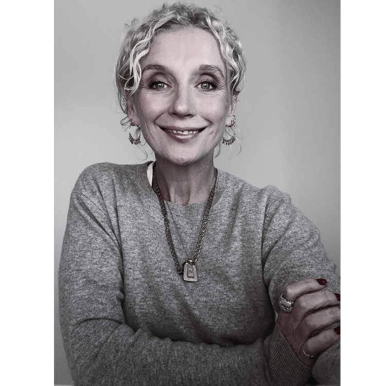 Kylie Hawkes, smiling, arms folded