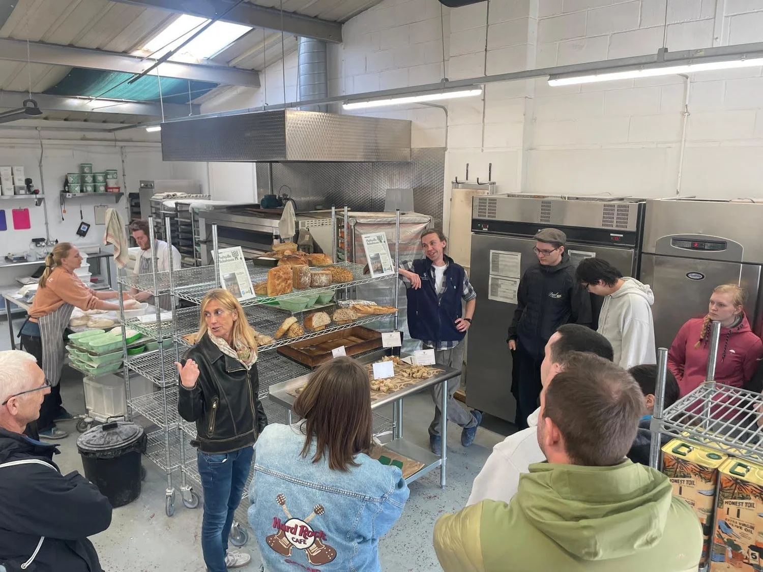 The team and visitors gathered in the bakery