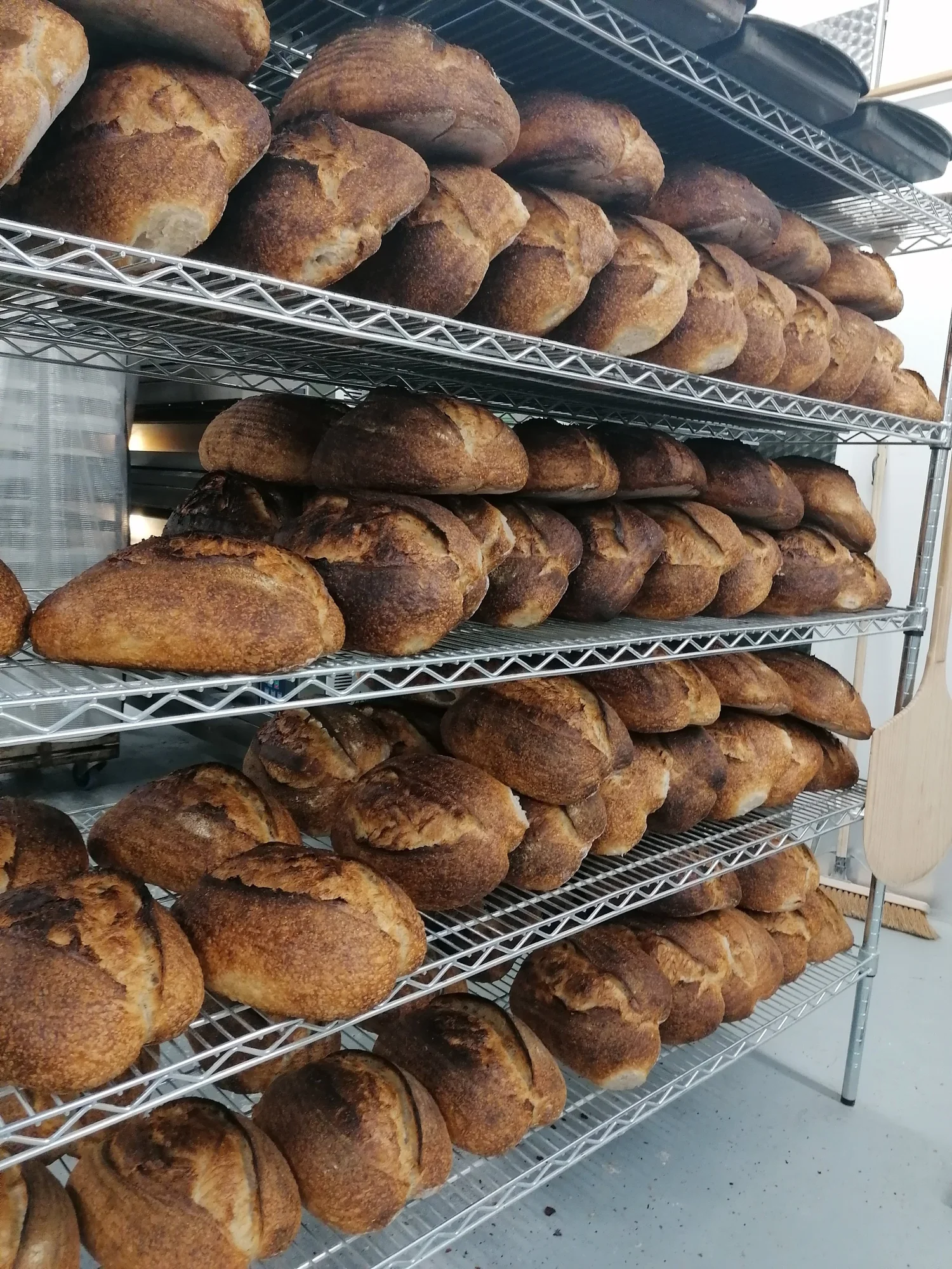 A tall rack of freshly baked loaves