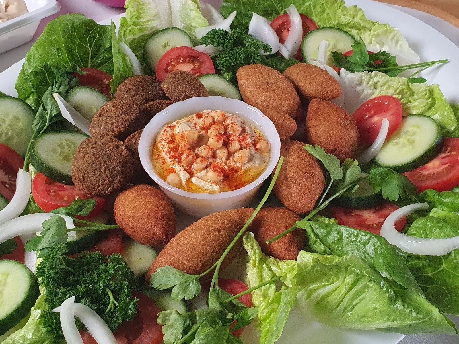 Almaz Foods falafel and kubbeh mezze platter with hummus and fresh salad
