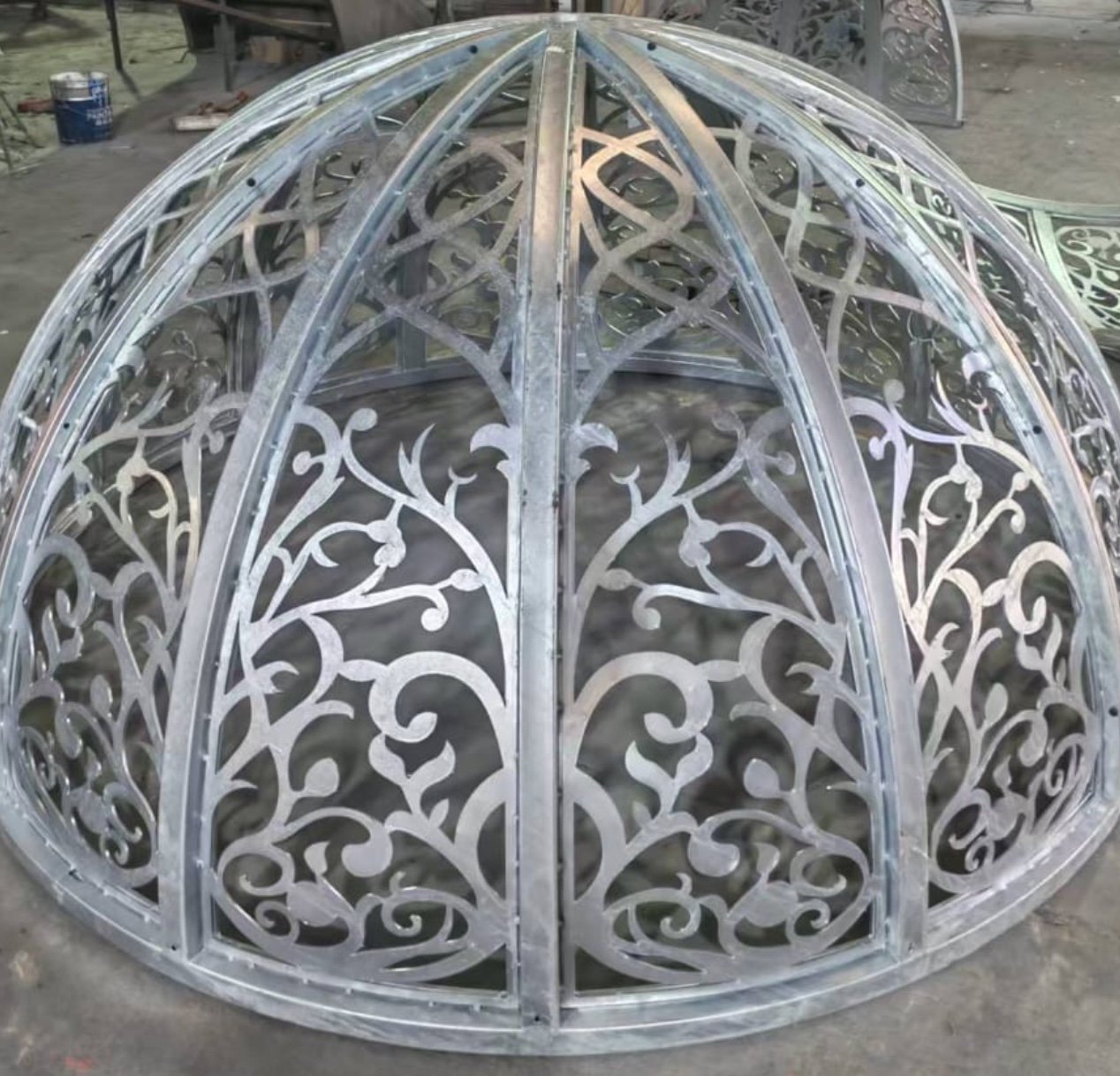 Unfinished metal frame of a poinsettia pendant lamp in the workshop