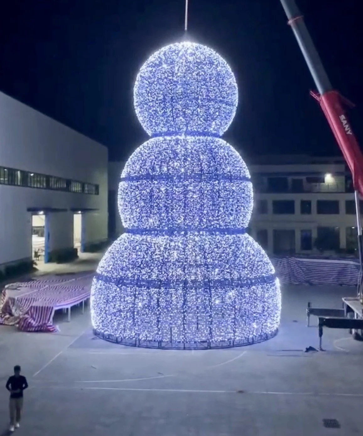 The completed 50-foot snowman illuminated at night