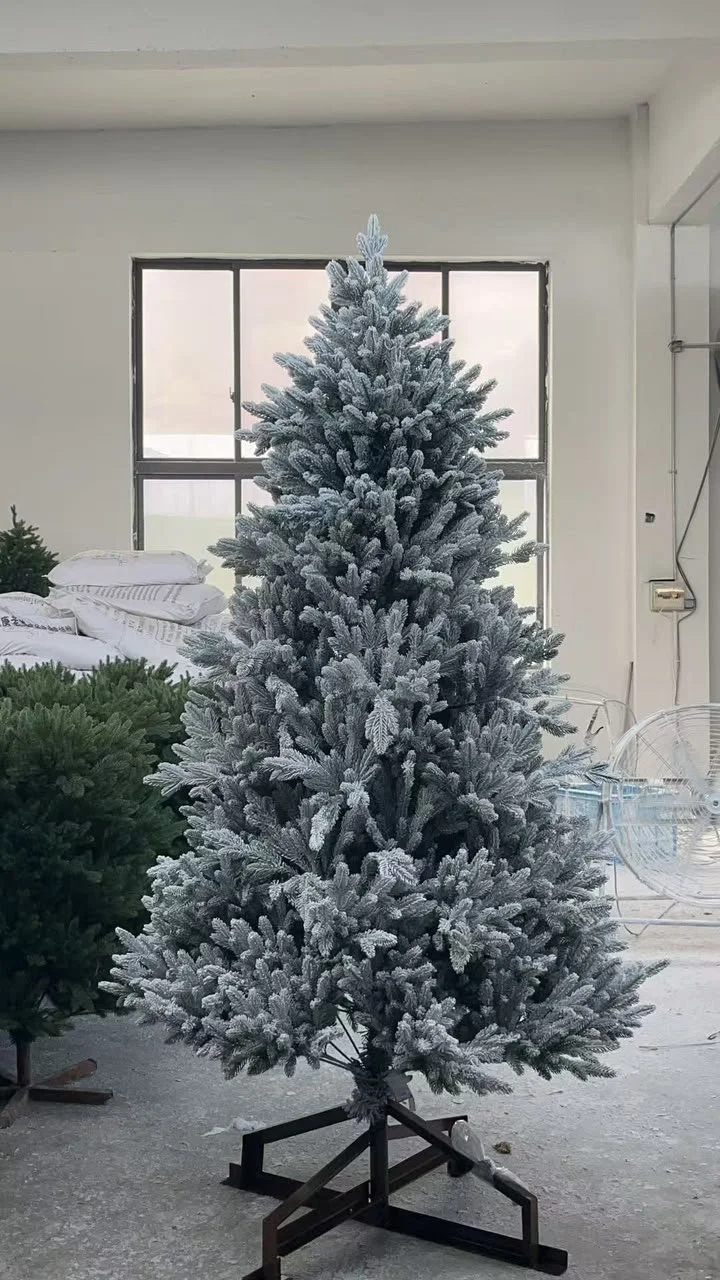 A custom snow-flocked tree mounted on a tall reinforced metal base