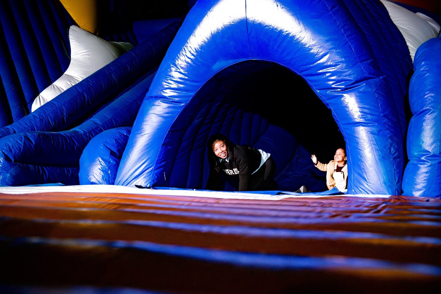 Guests crawling through the original Down the Chimney inflatable play experience