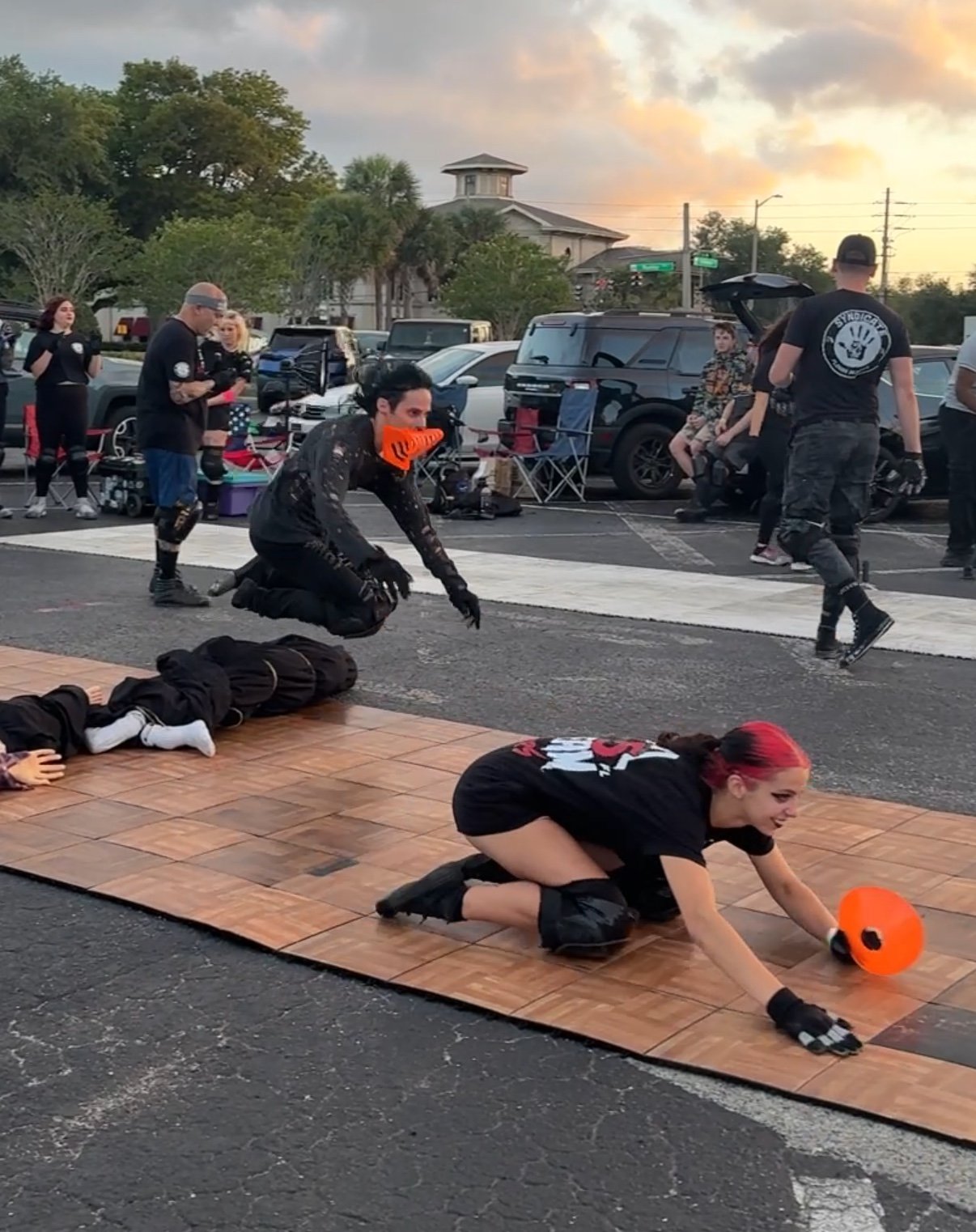 A slider moving across the performance floor on knee pads