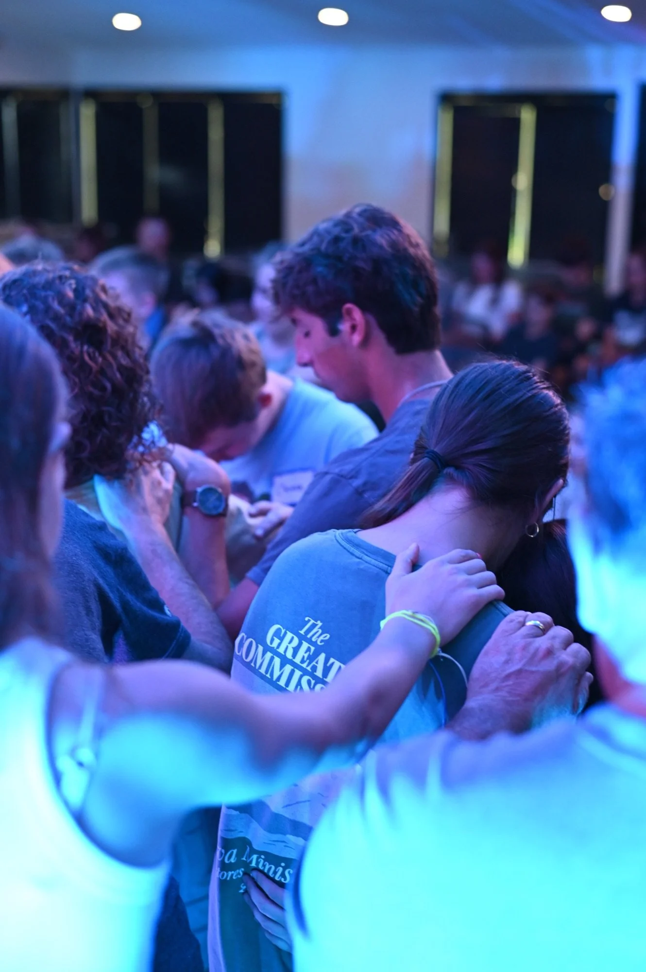 Students praying and encouraging one another at Anthem Students