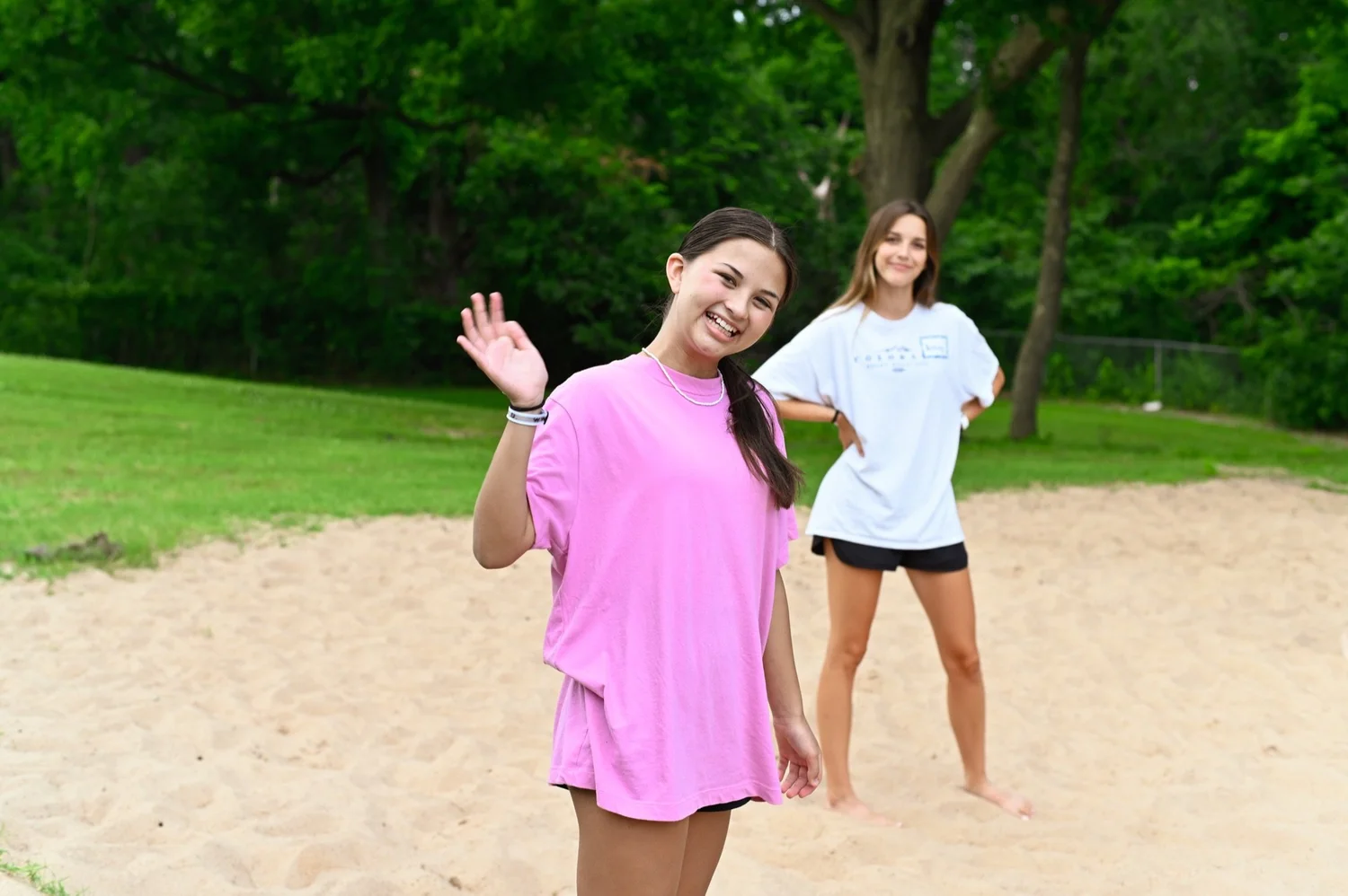 Students on the sand volleyball court at Anthem Students