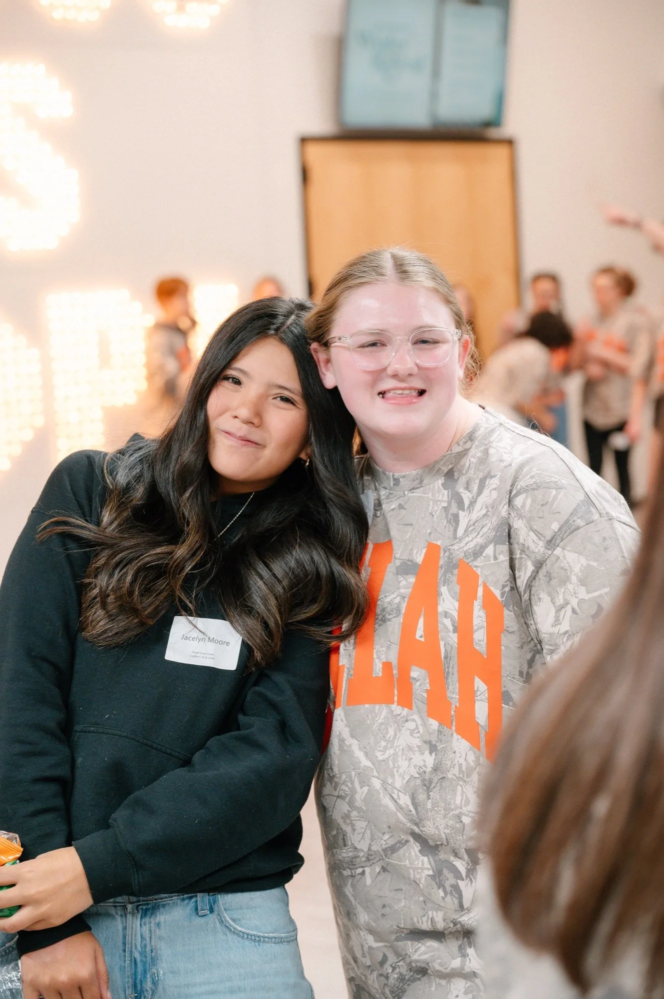 Students smiling together at an Anthem Students event