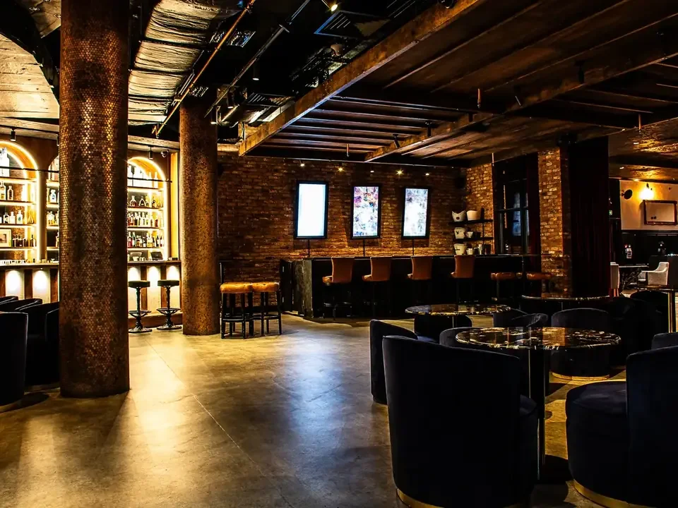 The Parade, the main space at 45 London, with a bar and big screens