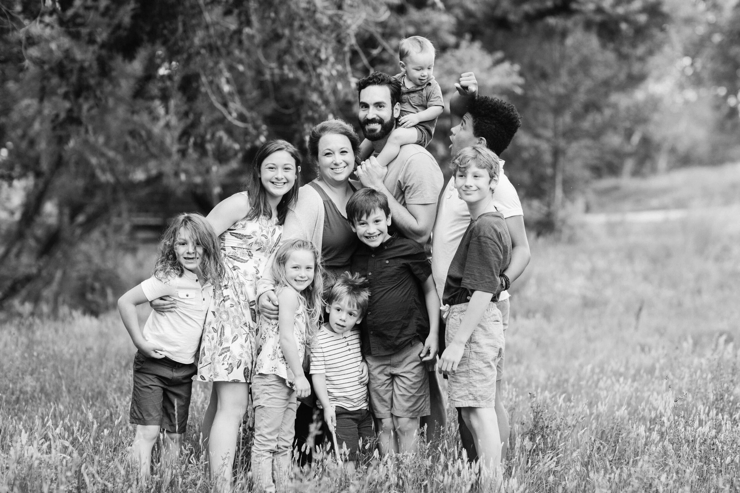 Family outdoors with Stokeshire dog