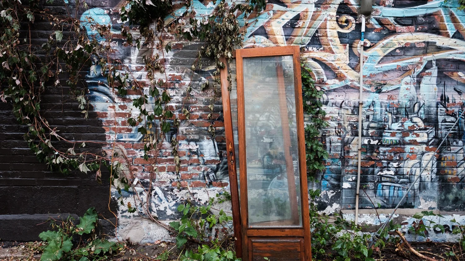 Montréal street art — colourful mural on brick wall, Fujifilm X series