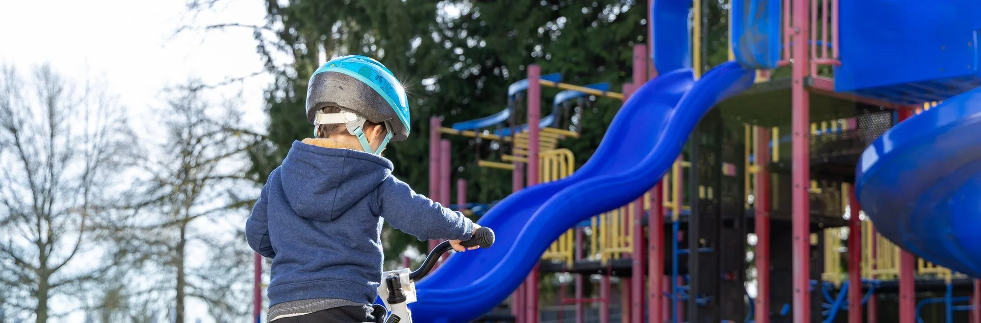 A child riding at a Burnaby playground