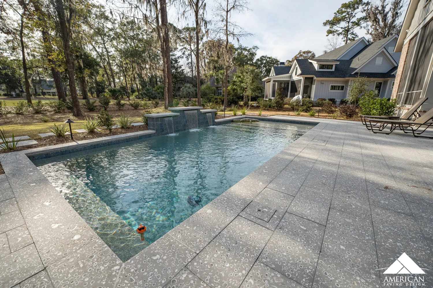 Oyster tabby shell paver pool deck with sheer water features in Bluffton, SC