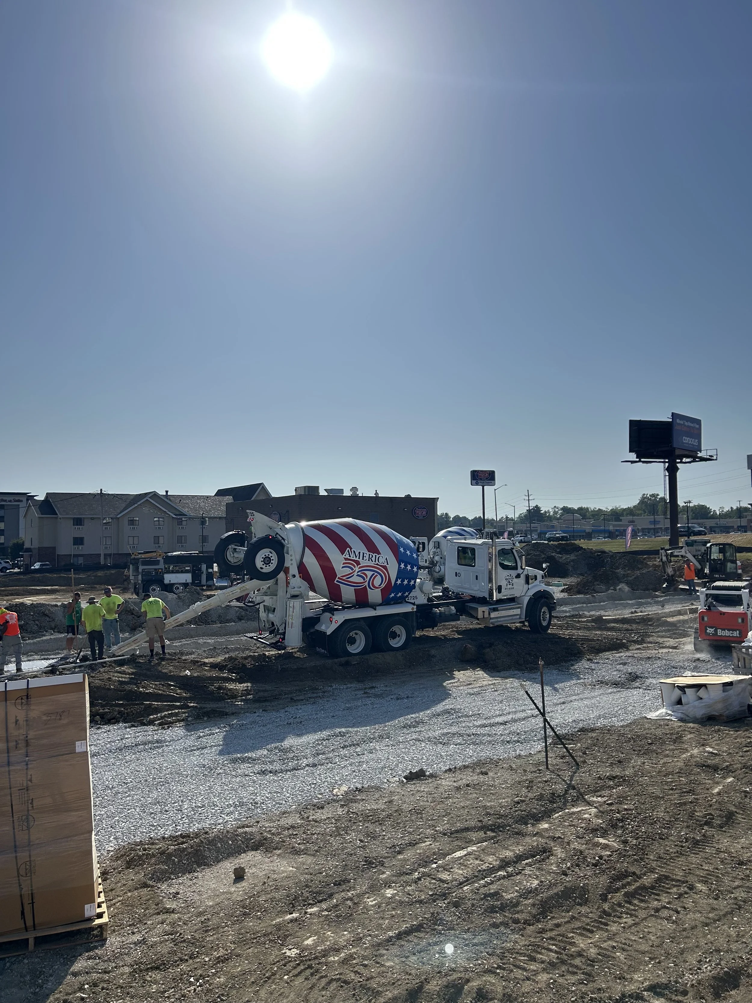 Kienstra concrete truck supplying an Alton car-wash foundation pour