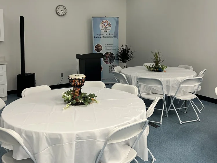 A podium and round tables in the Banquet Hall