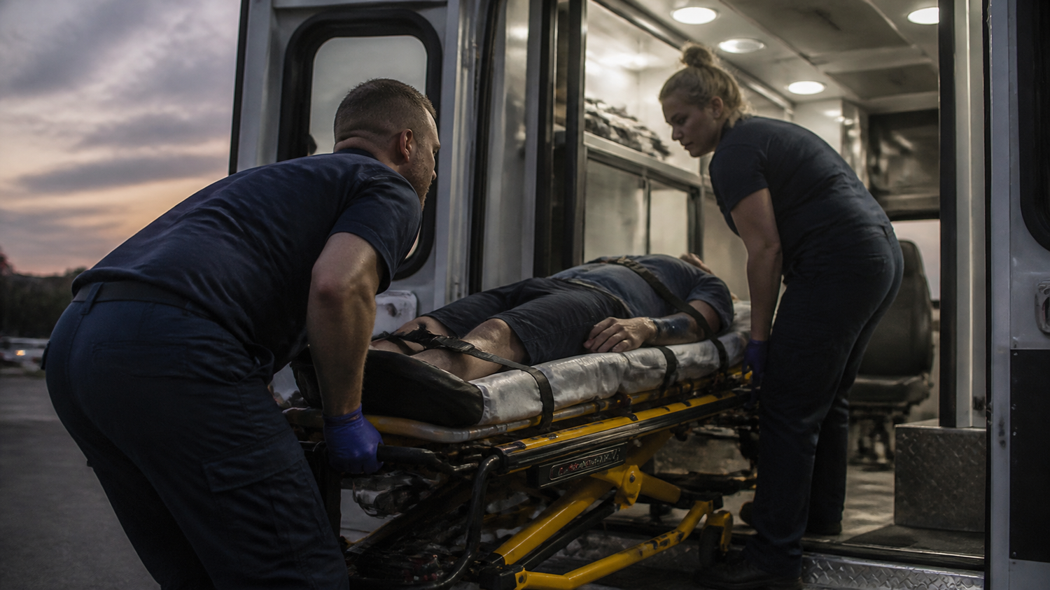 EMTs lifting a stretcher — lifting posture and alignment for first responders, Symmetry for Health