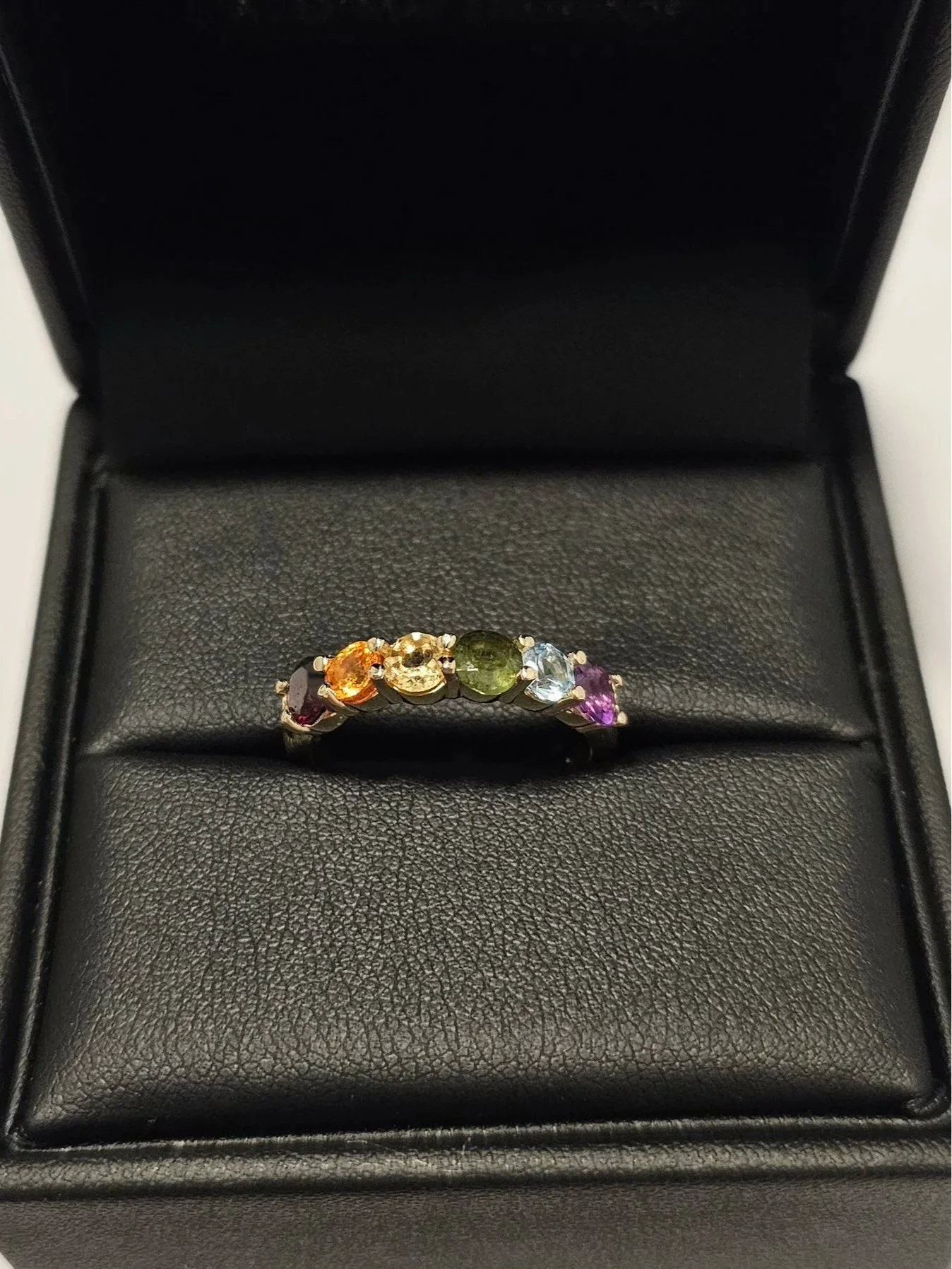 Finished custom rainbow pride ring in 14k yellow gold with grandmother's gemstones in A. D'Mae Diamonds presentation box, Los Angeles