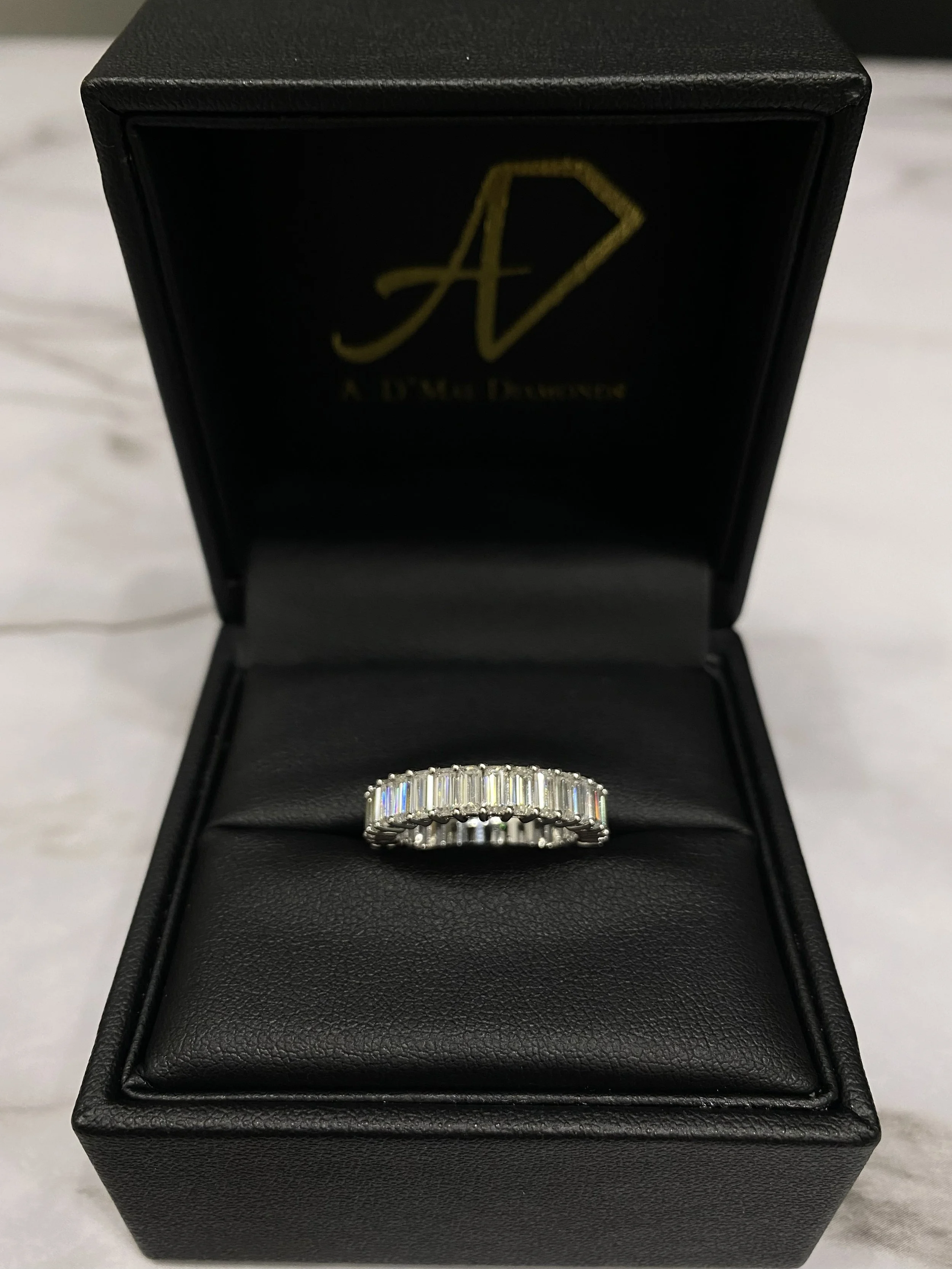 Emerald cut diamond eternity band in 14k white gold by A. D'Mae Diamonds Los Angeles