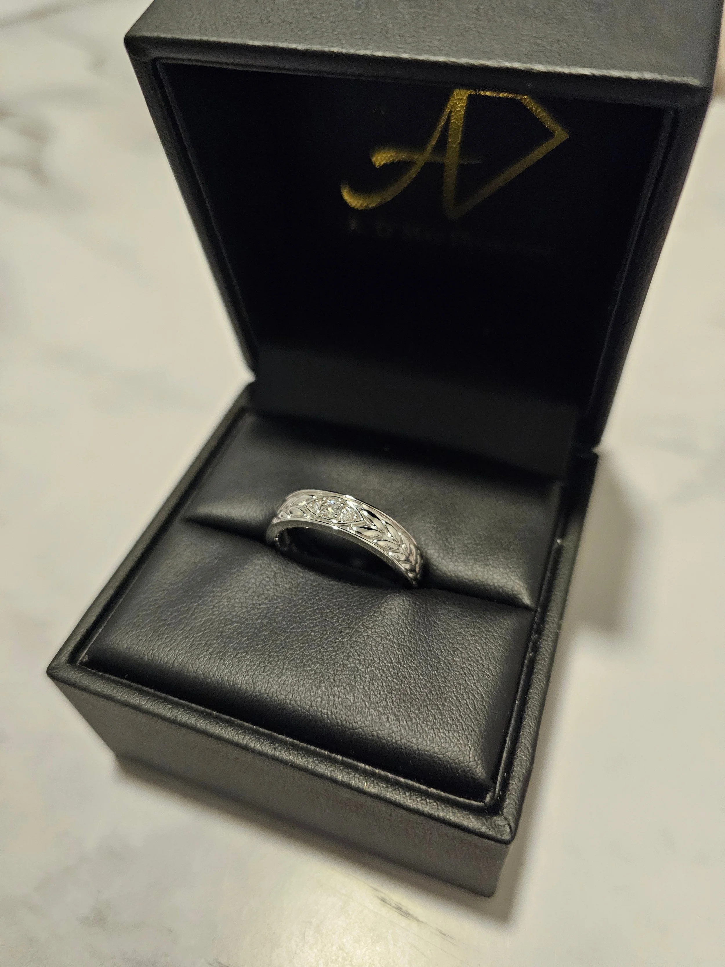 Custom women's diamond wedding band with leaf design in 14k gold by A. D'Mae Diamonds Los Angeles