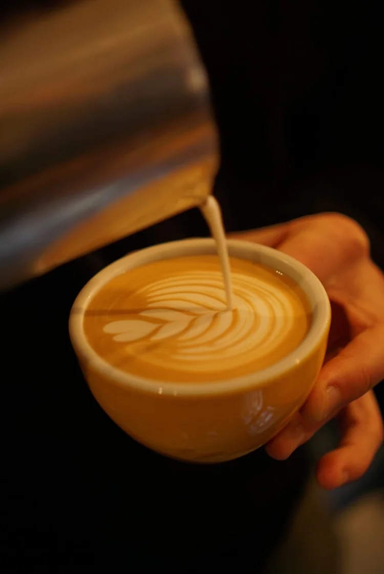Latte art being poured at Milligram